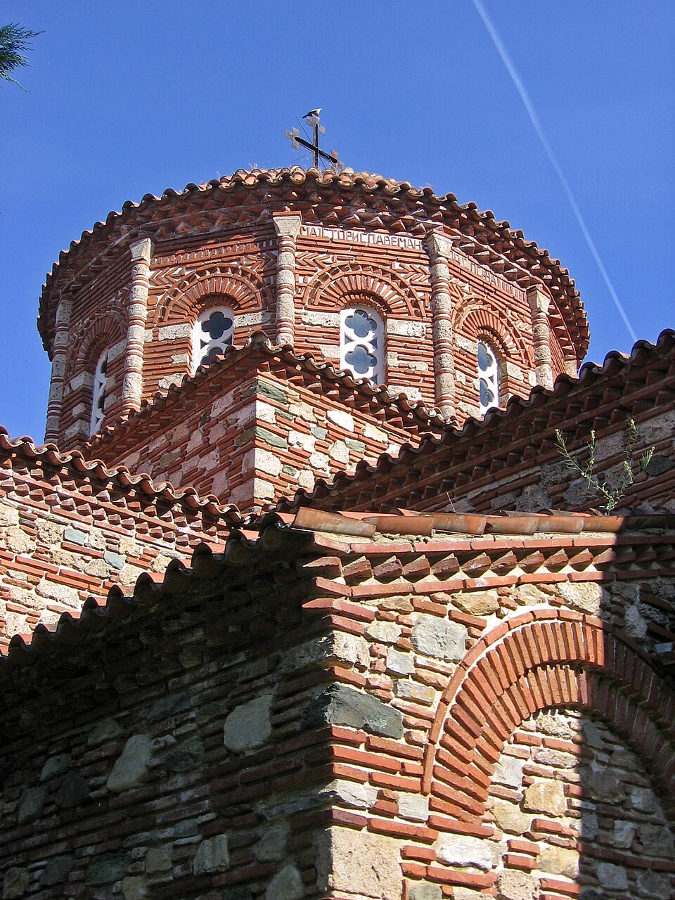 The brick dome and tiled roofs of the Church of St Leontius at Vodocha.