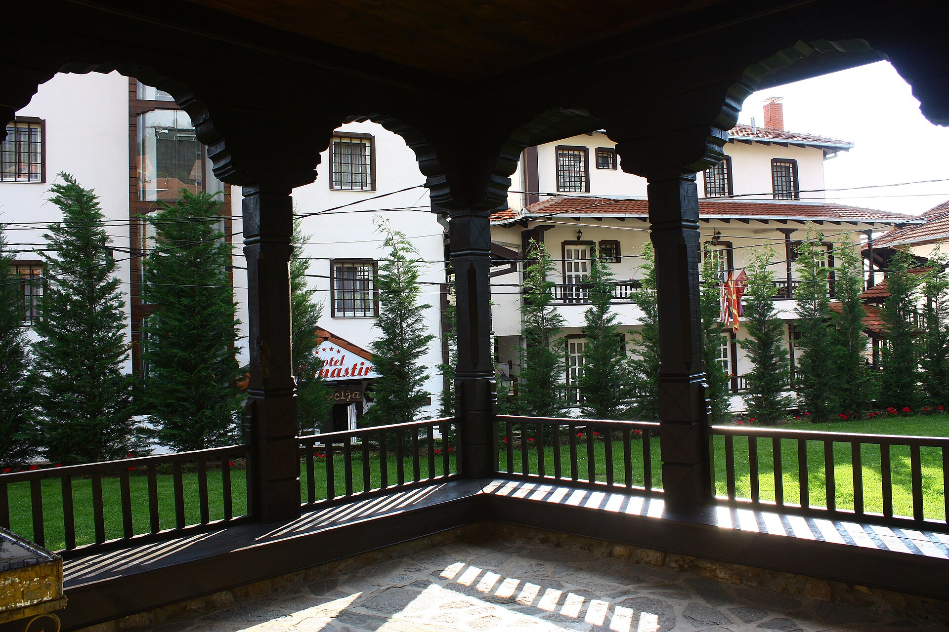 A wooden veranda looking into the monastery courtyard in Berovo.