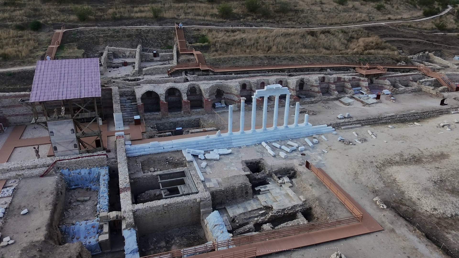 An elevated view of archaeological remains and restored columns at Heraclea Sintica.